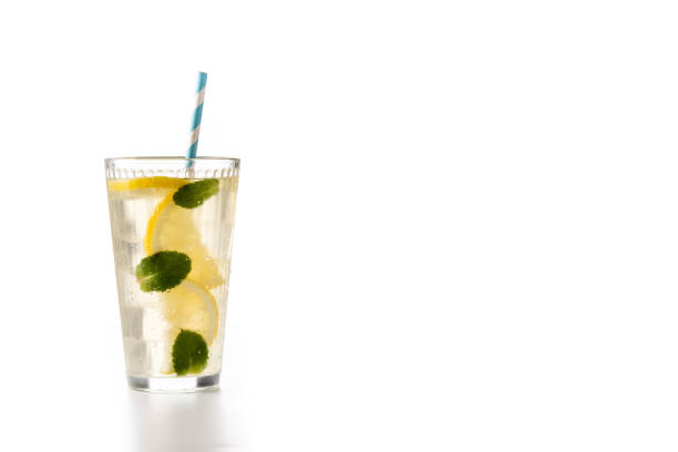 Glass of fresh lemonade isolated on white background
