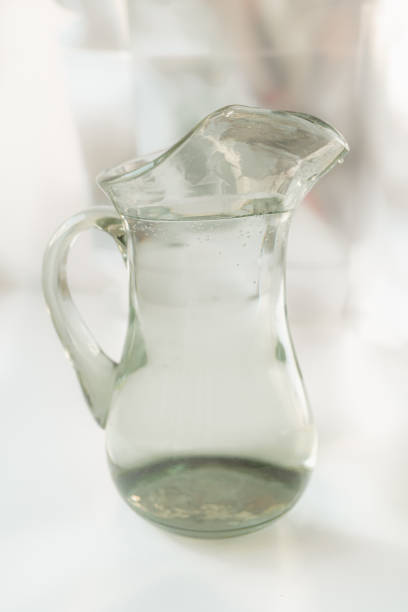 Clean water in glass jug, spring water in plumbing, operation of water filters