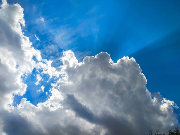 istock The sun's rays break through the dark clouds in the sky. Beautiful spectacular conceptual background of meditation. 1388366239