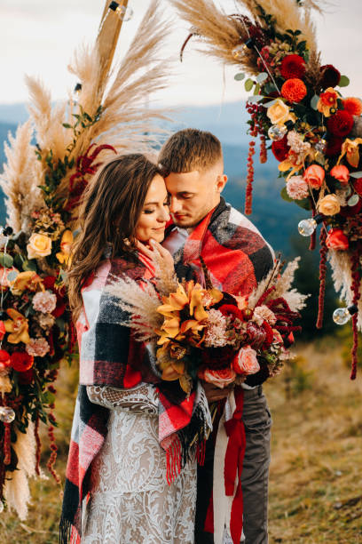 istock Young beautiful couple on the night wedding ceremony in mountains 1388367614
