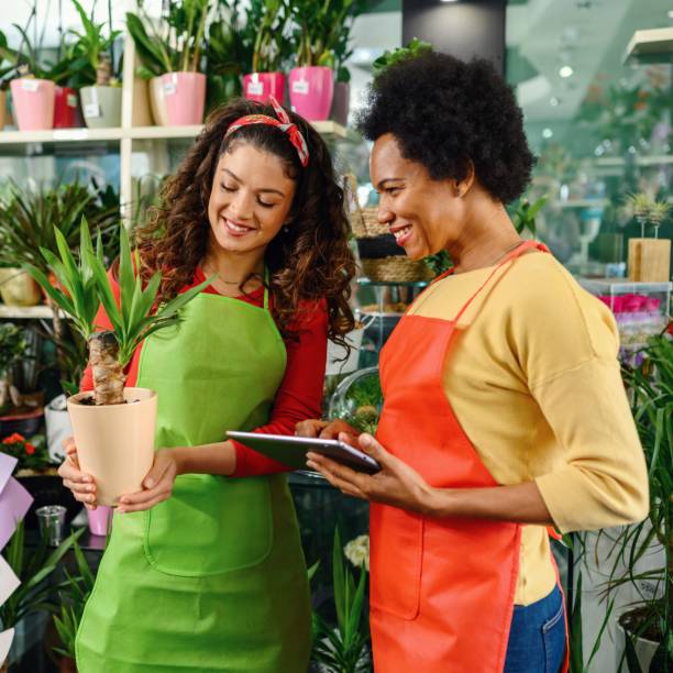 istock Two woman working in flower shop 1388367772