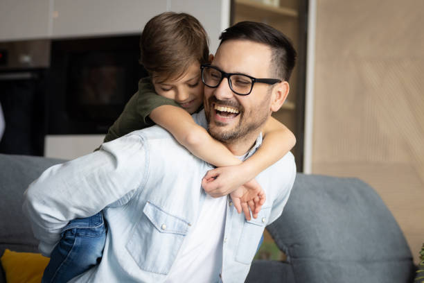 istock Father and son playing in the living room 1388367963