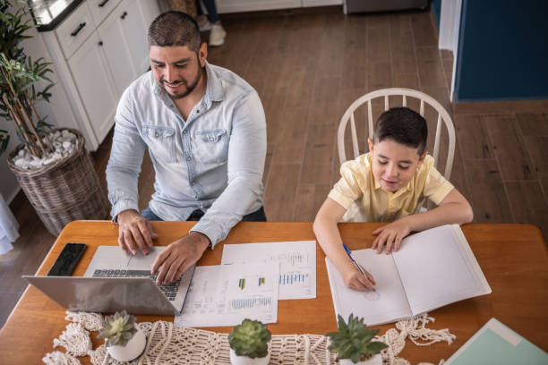 istock Boy studying and father working at home 1388370778