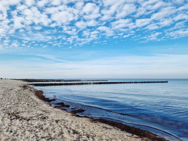 istock Very calm waters, white empty beach and blue sky 1388372792