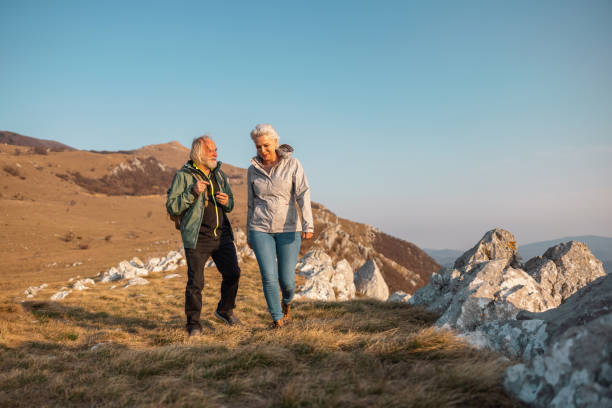 istock A Cool Senior Couple Taking A Walk In The Mountains 1388373261