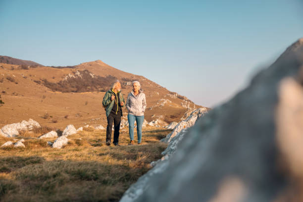 istock A Cool Senior Couple Taking A Walk In The Mountains 1388373278