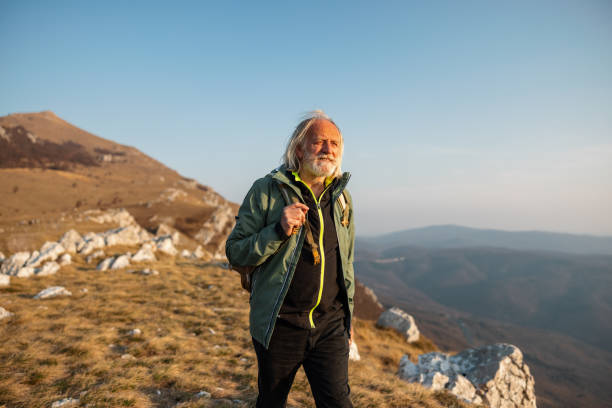 istock Portrait of a senior active hiker in the mountains 1388373365