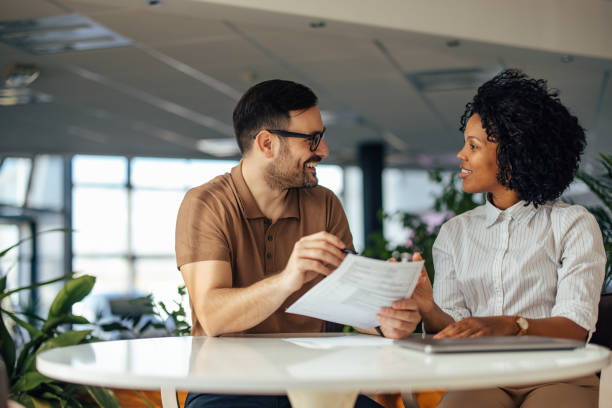 istock Male boss having a meeting with his client, smiling at each othe 1388373496