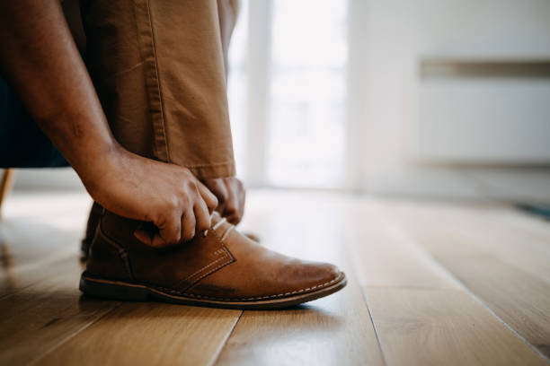 istock Business man dressing up with classic, elegant shoes 1388373776