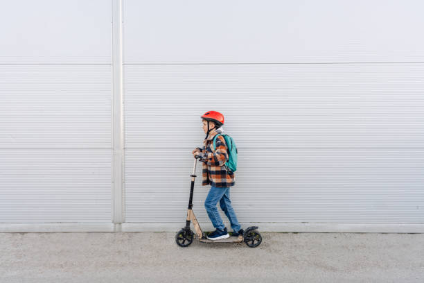 istock Commute to school by push scooter 1388375467