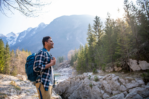 Young tourist from India exploring the Julian Alps, Slovenia, Europe.