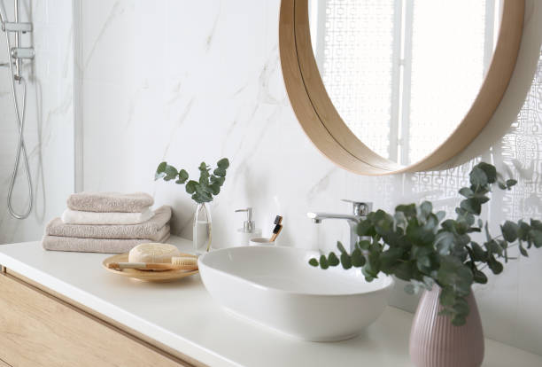 istock Fresh eucalyptus branches and bathroom items on countertop 1388375664