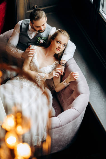 istock Incredible young couple sitting on sofa. Top view. 1388376089