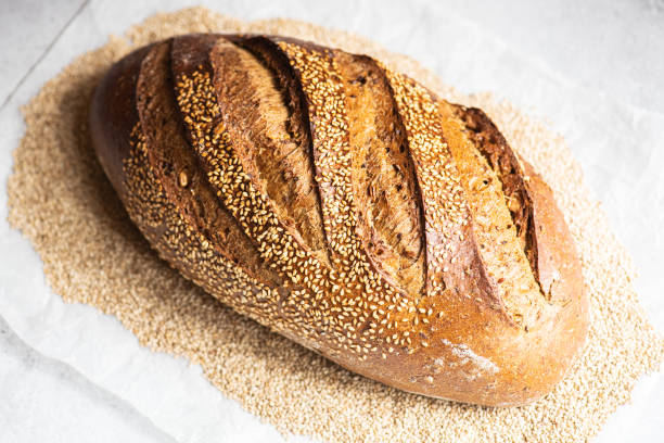 istock Artisanal sourdough bread with sesame seeds. Close up. 1388377124