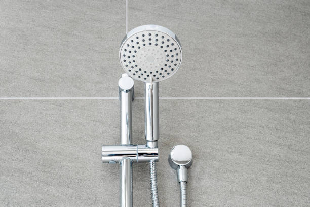istock Silver shower head closeup in bathroom 1388377148