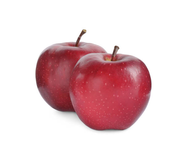 istock Fresh ripe red apples isolated on white 1388377207