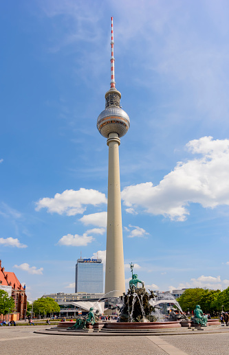 Television tower and Neptune fountain on Alexanderplatz square, Berlin, Germany