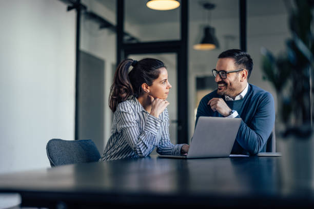 istock Business people, looking at each other, having a conversation. 1388378593