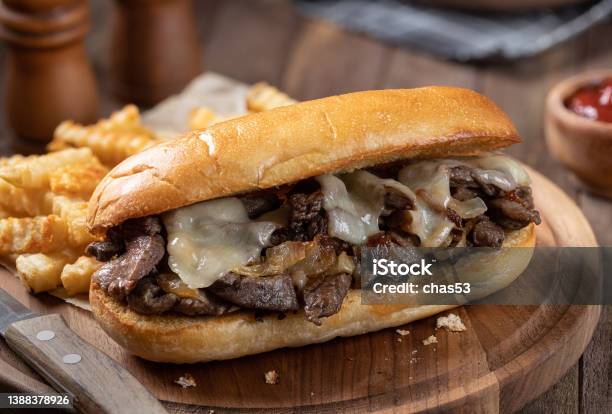 Philly Cheesesteak Sandwich And French Fries Stock Photo - Download Image Now - Philadelphia Cheese Steak, Steak, Submarine