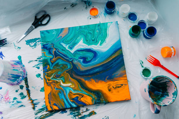 istock Creation process of fluid art. Liquid acrylic artwork with beautiful mixed paints 1388379043