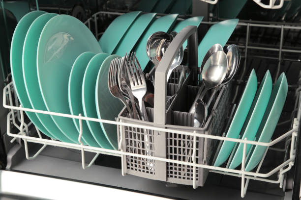 istock Dishes and cutlery on dishwashing machine. Clean dishes 1388379780