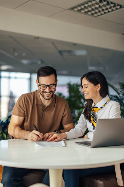 istock Delighted caucasian company executives, reading a document toget 1388380101