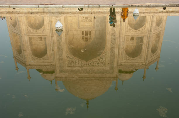 The Taj Mahal main building reflected in a water tank. Agra. Uttar Pradesh. India.