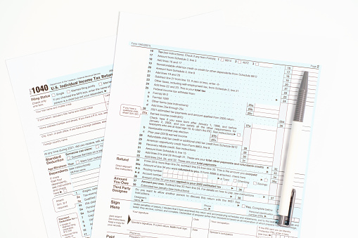 Blanks with tax forms close-up on a white background top view.