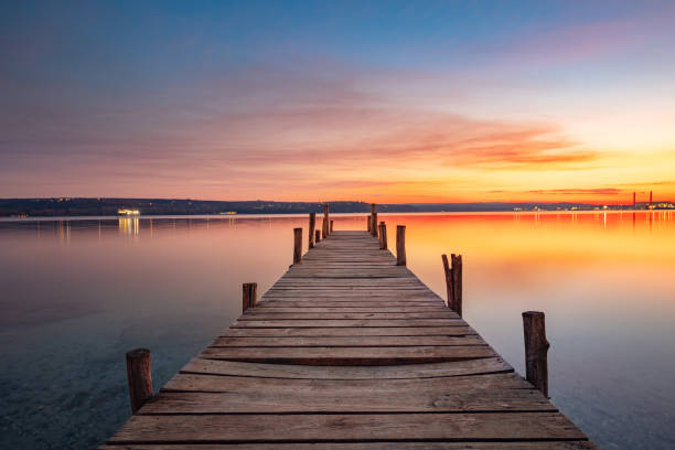 istock Small Dock and the lake at sunset 1388387930