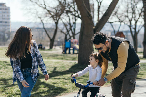 istock Family have fun in public park at springtime 1388389226