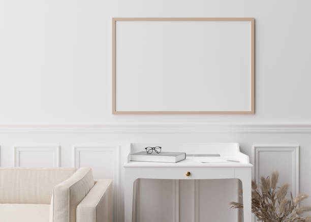 istock Empty picture frame on white wall in modern living room. Mock up interior in contemporary style. Close up view. Free space for your picture, poster. Console, vase, pampas grass. 3D rendering. 1388389585