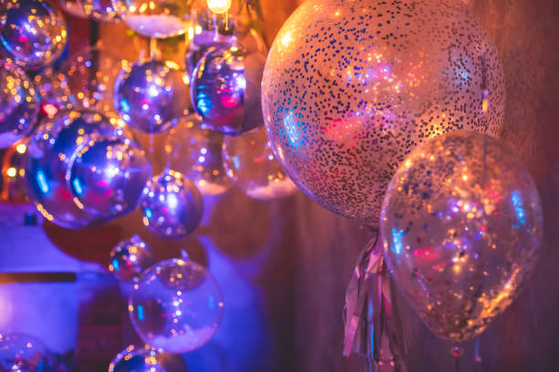 istock Decoration interior elements of restaurant venue banquet hall with multicoloured different helium balloons, on a indoor corporate event or wedding reception or birthday party celebration 1388391988