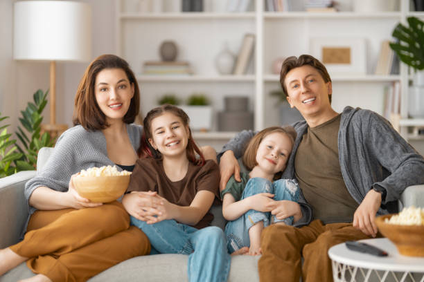 istock Mother, father and daughters spending time together. 1388392049