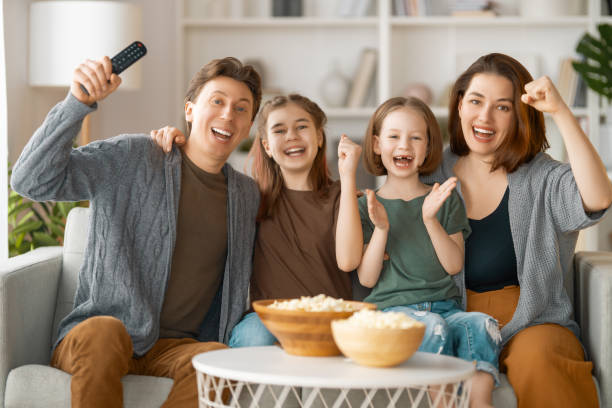 istock Mother, father and daughters spending time together. 1388392065