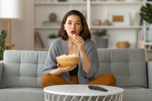 istock woman watching TV 1388392077