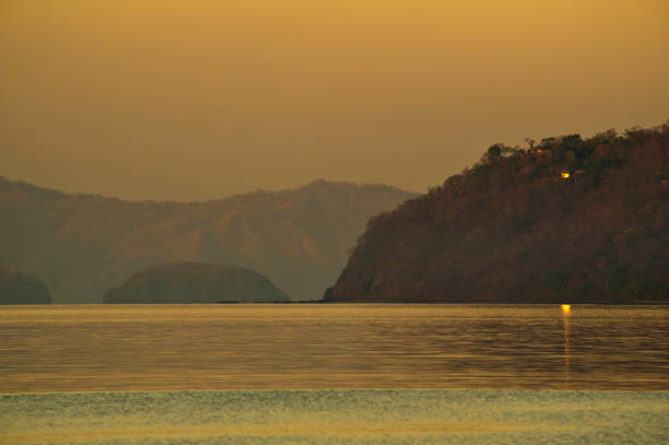 Lonely light. Papagayo Bay at sunset