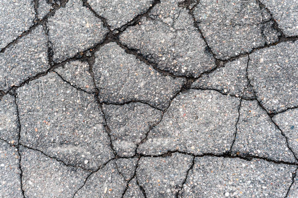 istock Old crack asphalt road. Textured Background 1388394732
