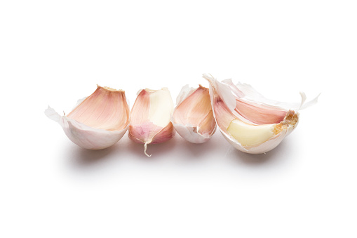 Cloves of garlic isolated on white