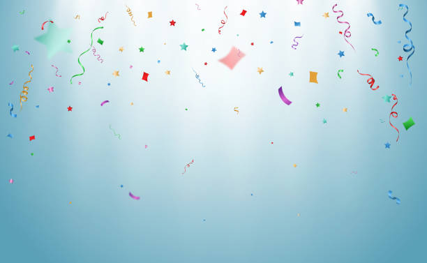 istock confetti falls on a beautiful background. Falling streamers on stage. 1388396380