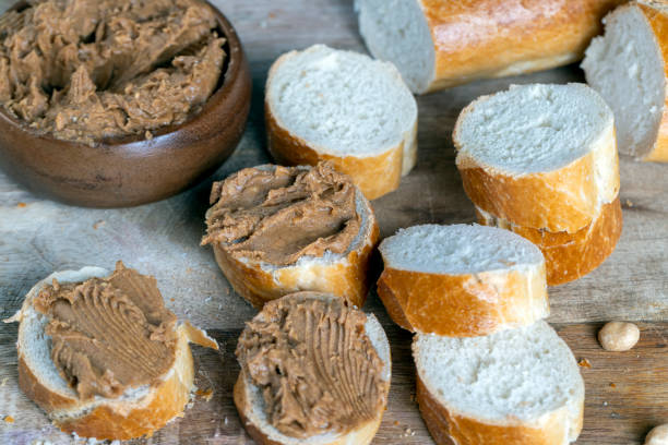 istock peanut paste with pieces of peanuts and white baguette 1388396701