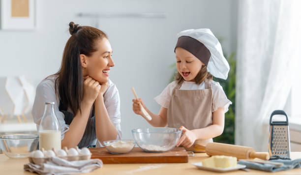 istock family are preparing bakery together 1388398213