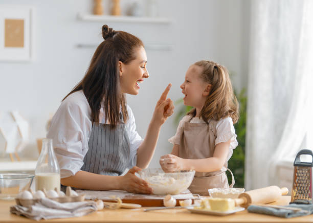 istock family are preparing bakery together 1388398216