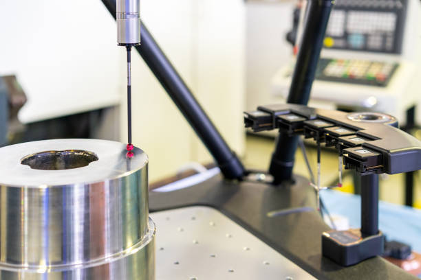 istock Close up head probe (touch with work piece) of automatic coordinate measurement machine (CMM) instrument for inspection high precision and accuracy part during working 1388398265