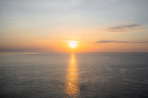 Sunset into the sea with twilight sky