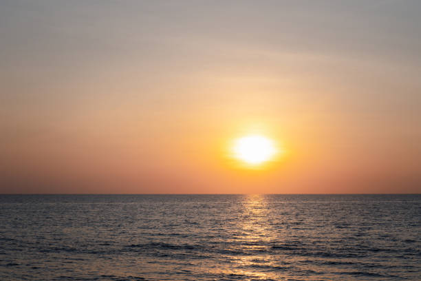 istock Sunset into the sea with twilight sky 1388399391