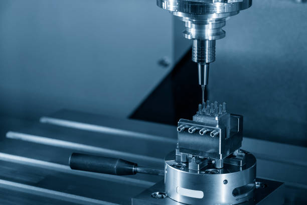 The CNC milling machine cutting the copper electrode parts with sloid ball endmill. stock photo