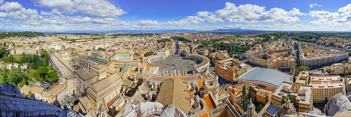 Italy, Rome, Vatican, 11.10.2021 Famous Saint Peter's Square in Vatican and aerial view of the Rome city during sunny day.