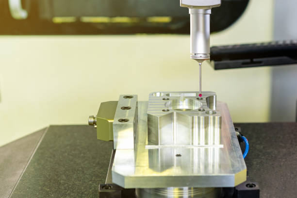 istock Close up head probe (touch with work piece) of automatic coordinate measurement machine (CMM) instrument for inspection high precision and high accuracy part during working 1388401092