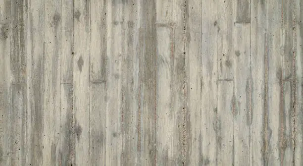 texture of old gray grunge concrete wall with embedded grain and pattern of wooden planks for background