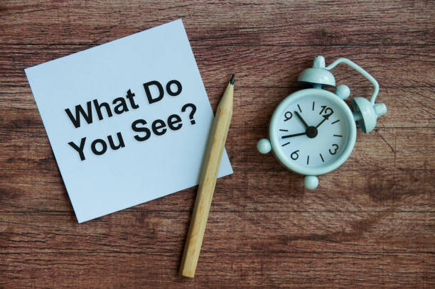 istock What do you see text on notepad with clock and pencil. 1388401888